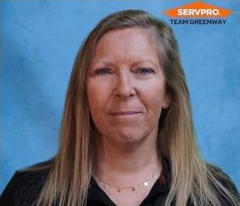 female employee with blond hair wearing a black SERVPRO shirt