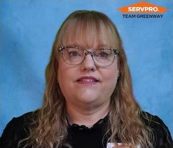 female employee with blond hair wearing a black SERVPRO shirt