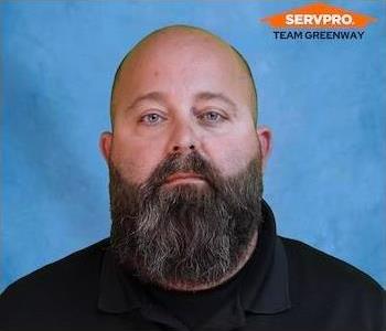 male employee wearing a black SERVPRO shirt 